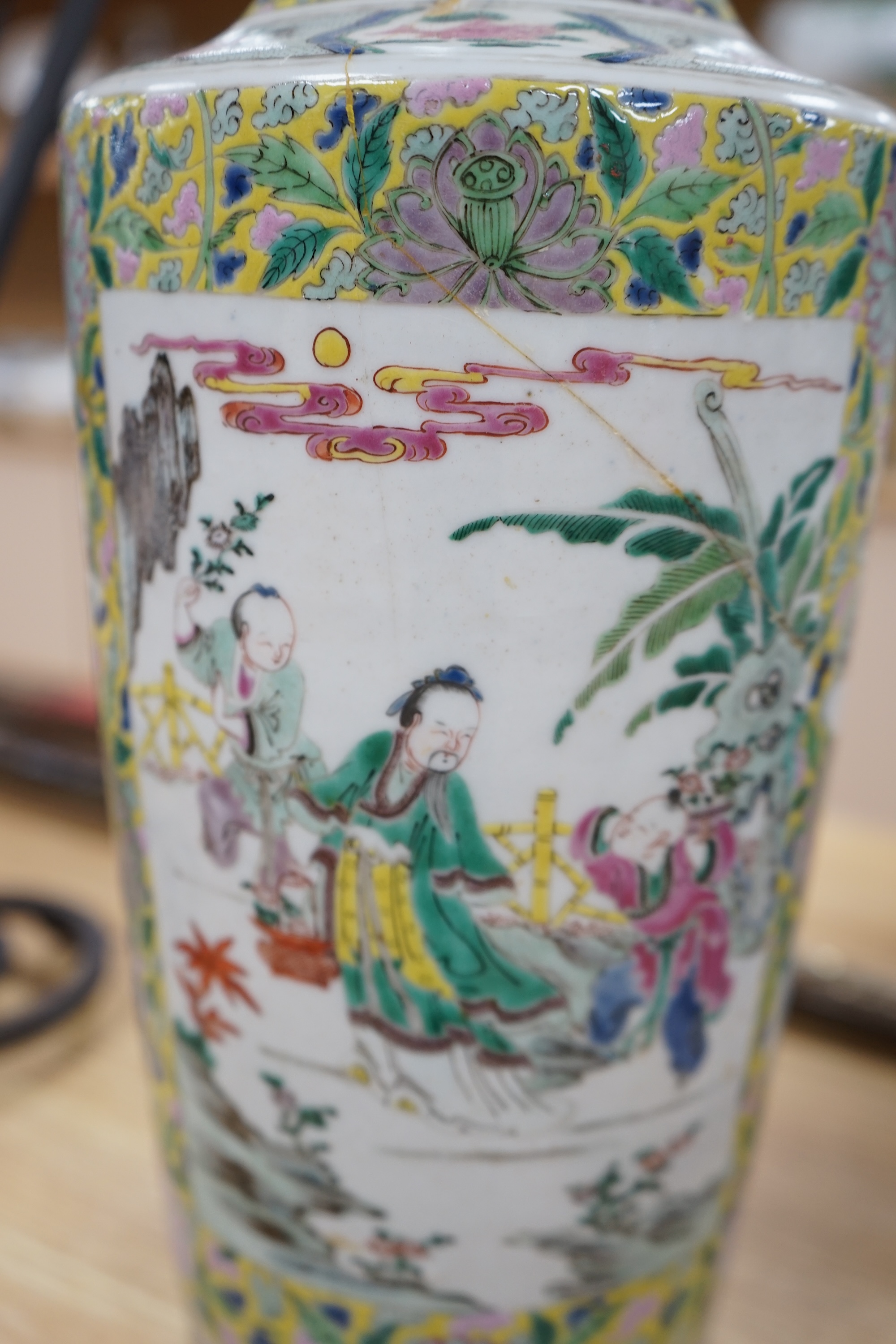 A 19th century Chinese famille rose porcelain vase enamelled with figures and flowers, converted to a lamp base, 43cm high. Condition - poor